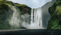 Landscape view of Skogafoss waterfall in cool colors, Skogar, Iceland